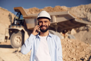 How To Choose The Right Aggregate For Your Next Project; man on phone