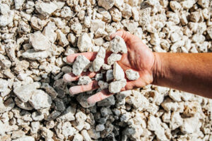 Shape, Structure and Size of the Aggregate; hand holding stone